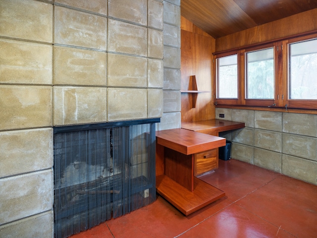 room details with wooden ceiling and a fireplace