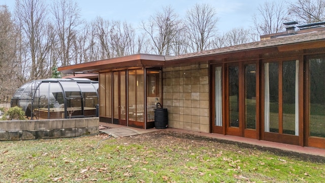 exterior space with a sunroom