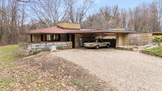 view of front of property featuring a carport