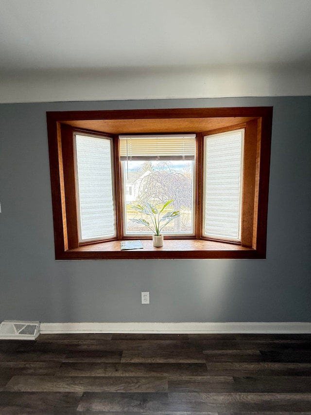 empty room featuring dark hardwood / wood-style floors