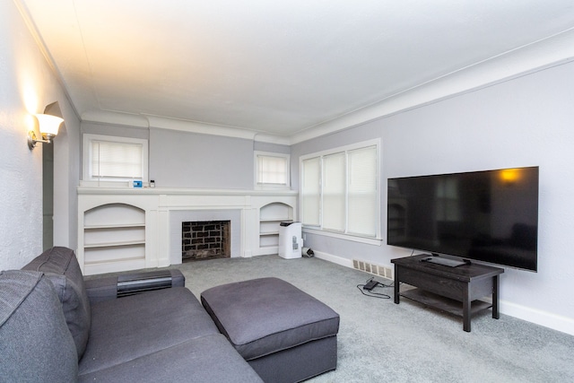 carpeted living room with built in shelves and crown molding