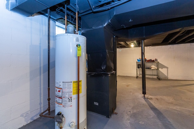 utility room featuring gas water heater