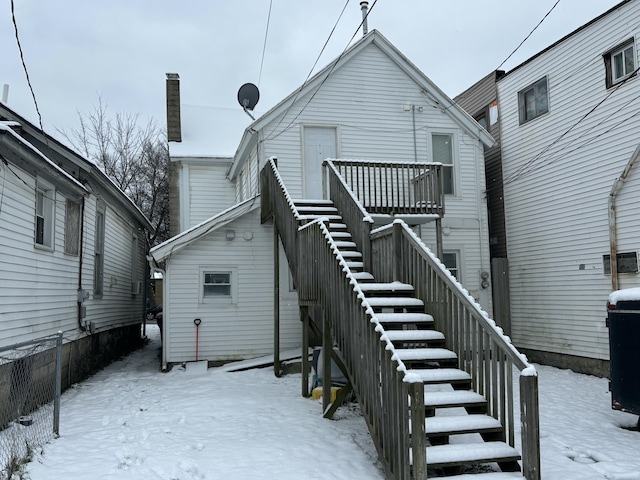 view of snow covered house