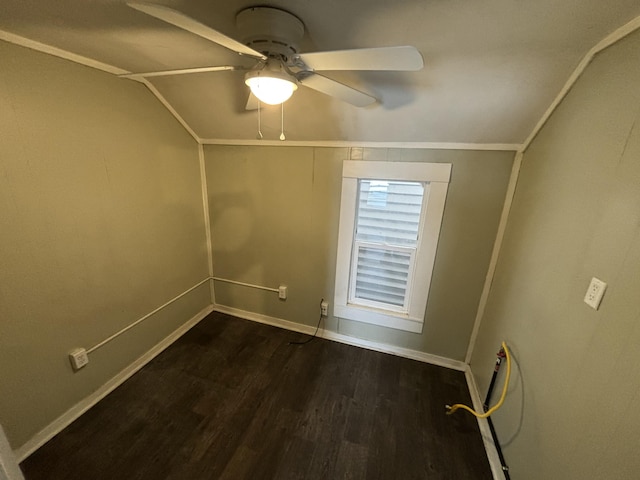 spare room with ceiling fan, dark hardwood / wood-style flooring, and vaulted ceiling