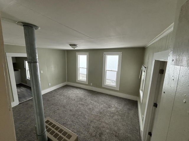 carpeted spare room with crown molding