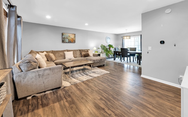 living room with dark hardwood / wood-style floors