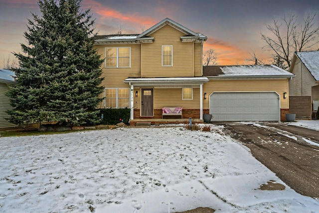 front of property with a garage