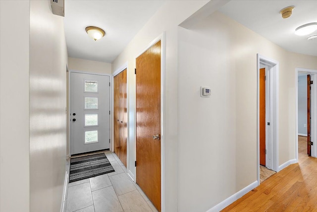 foyer entrance with light hardwood / wood-style flooring