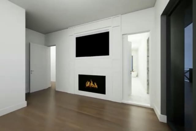 unfurnished living room with dark hardwood / wood-style flooring