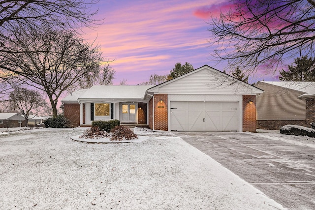 single story home featuring a garage