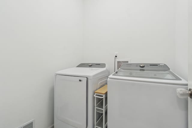 laundry room featuring independent washer and dryer