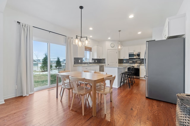 dining area featuring hardwood / wood-style floors