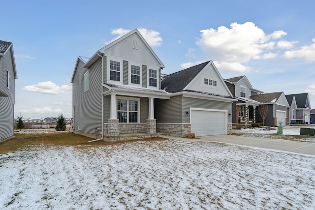 view of front of house with a porch and a garage