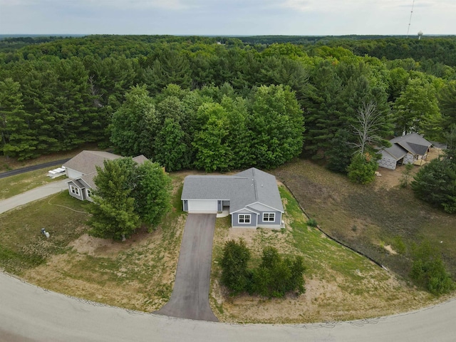 704 Eden St, Kingsley, MI 49649 - view of subject property featuring a heavily wooded area