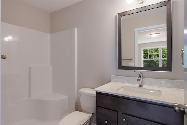 704 Eden St, Kingsley, MI 49649 - bathroom featuring vanity and a shower