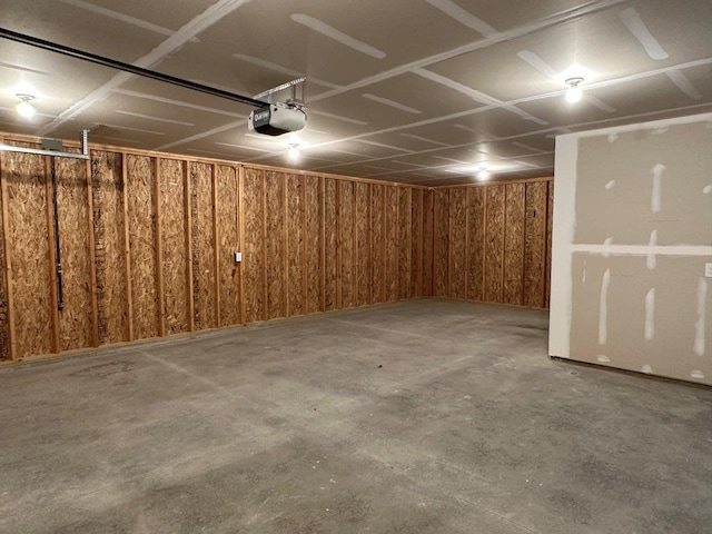 704 Eden St, Kingsley, MI 49649 - garage featuring a garage door opener