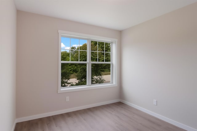 704 Eden St, Kingsley, MI 49649 - unfurnished room with light wood finished floors and baseboards
