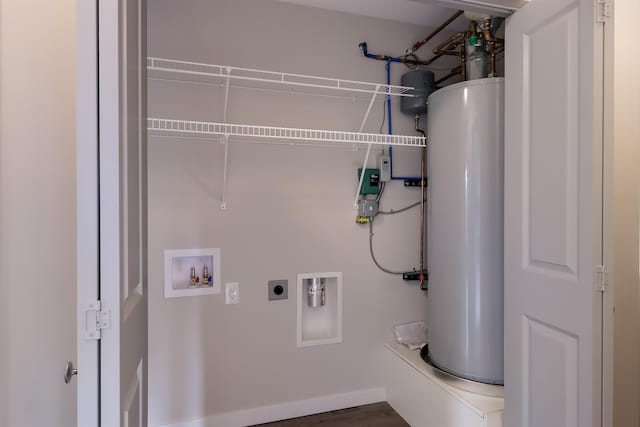 704 Eden St, Kingsley, MI 49649 - laundry room with gas water heater, hookup for an electric dryer, washer hookup, and wood finished floors