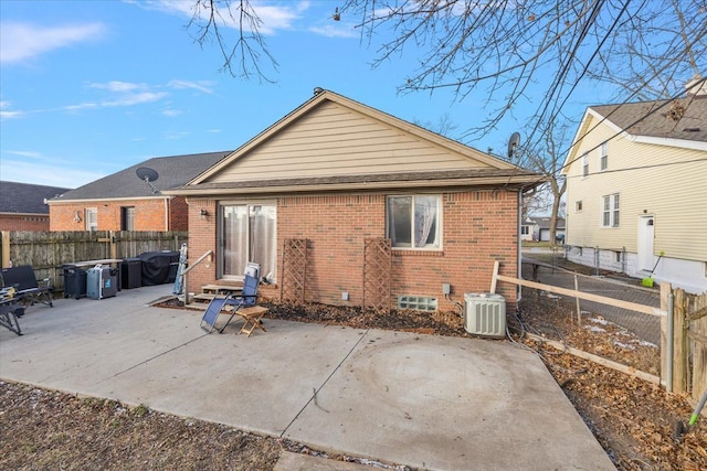 rear view of house featuring central AC and a patio