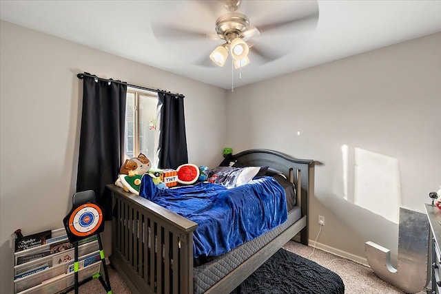 bedroom with ceiling fan and light carpet