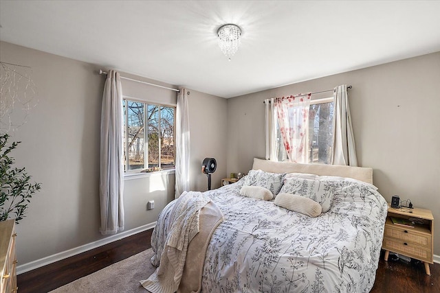 bedroom with dark wood-type flooring