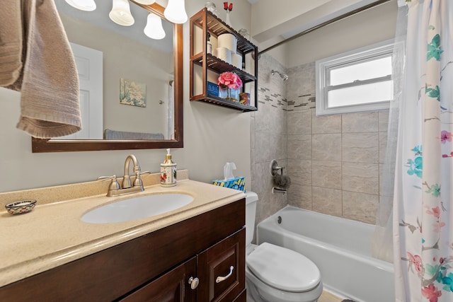 full bathroom with toilet, vanity, and shower / tub combo with curtain