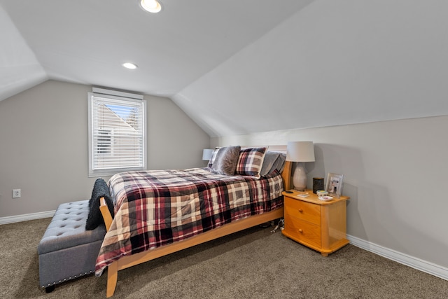 bedroom featuring dark carpet and lofted ceiling