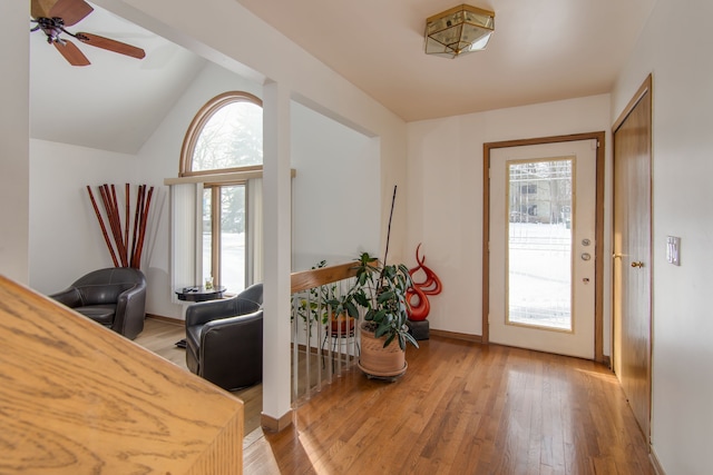 entrance foyer featuring lofted ceiling, light wood-type flooring, plenty of natural light, and ceiling fan