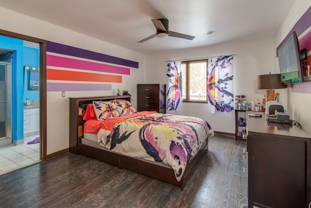 bedroom featuring ceiling fan, dark hardwood / wood-style flooring, and ensuite bath