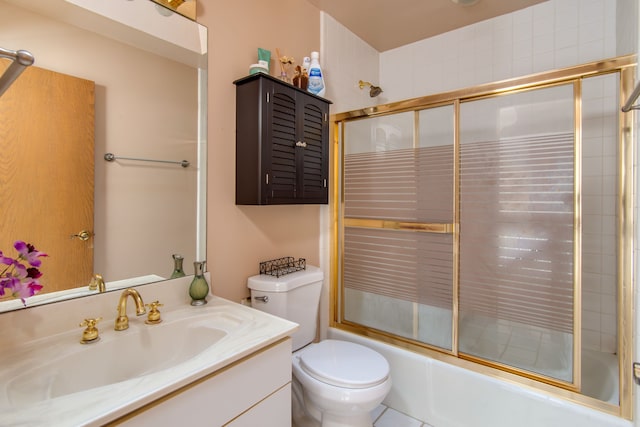 full bathroom featuring toilet, enclosed tub / shower combo, and vanity