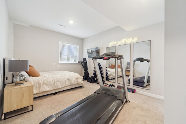 bedroom featuring light colored carpet