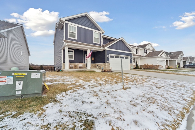 view of front of house featuring covered porch and a garage