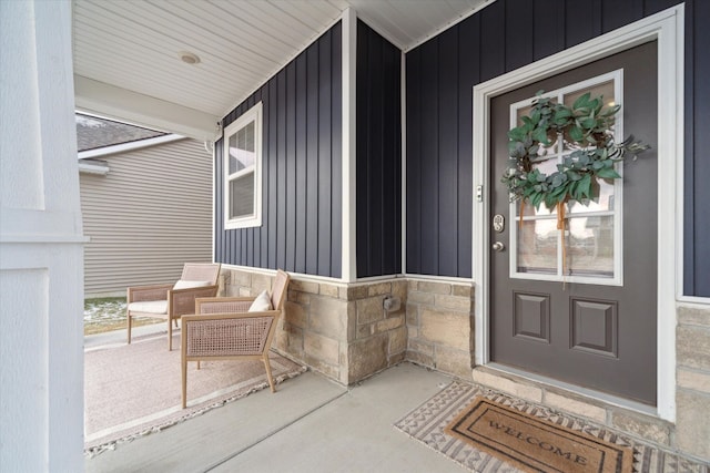 doorway to property featuring covered porch