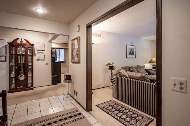 hallway featuring light tile patterned floors