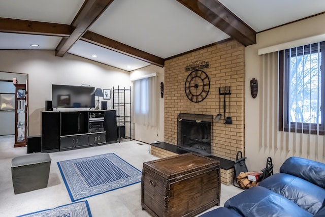 living room featuring lofted ceiling with beams and a fireplace