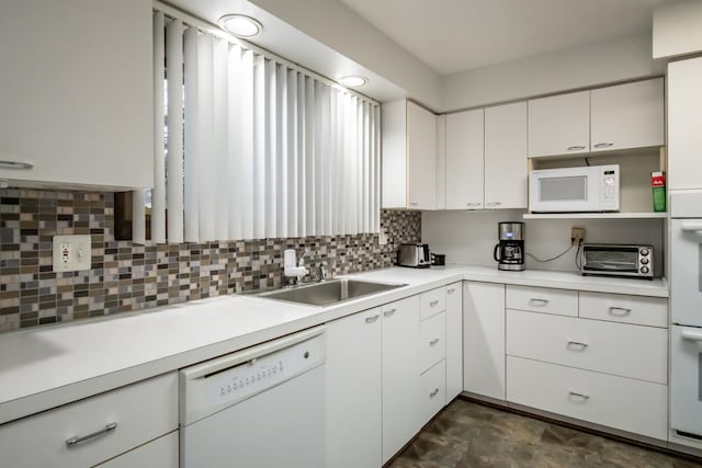 kitchen featuring sink, white appliances, decorative backsplash, and white cabinets