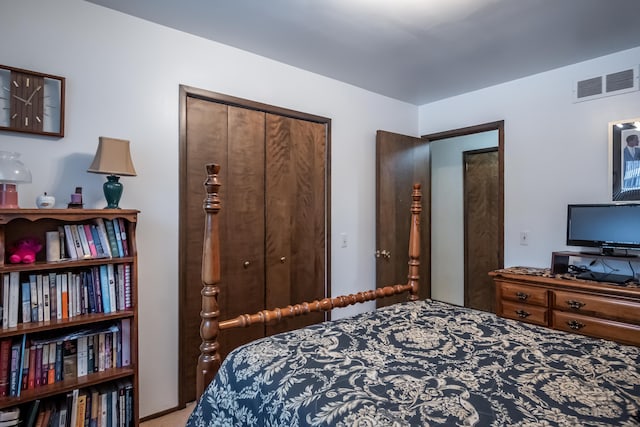 carpeted bedroom with a closet