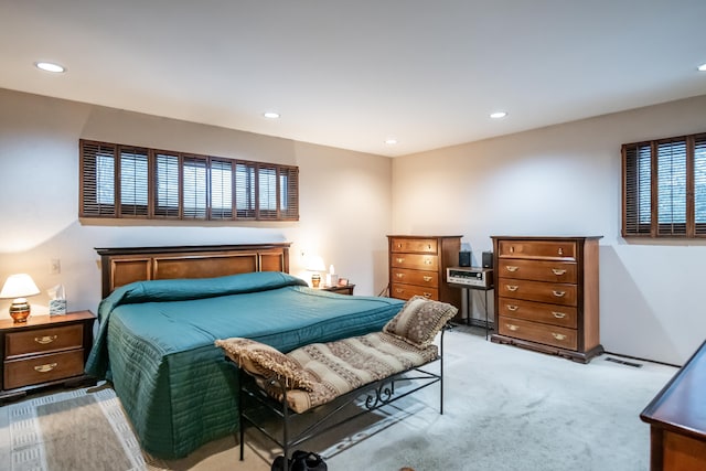 bedroom featuring light colored carpet