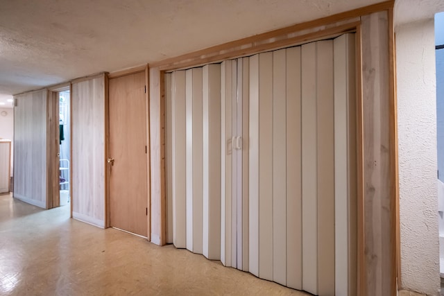 interior space with a textured ceiling