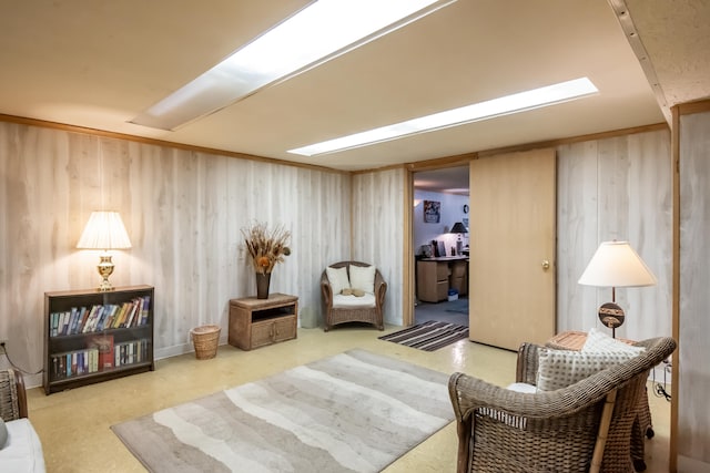 sitting room featuring wooden walls