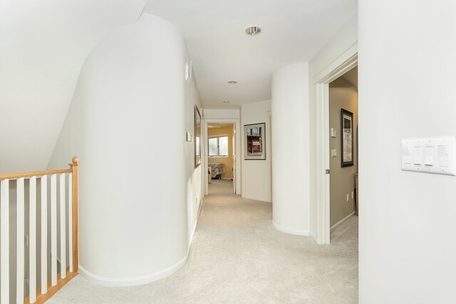 corridor with light colored carpet