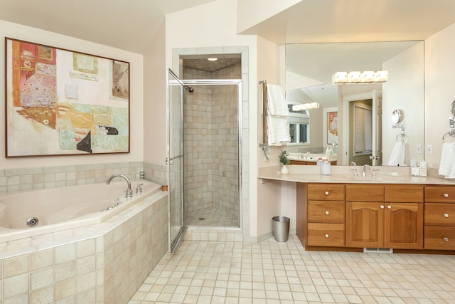 bathroom with vanity, tile patterned floors, and plus walk in shower