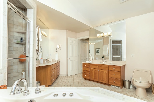 bathroom featuring vanity, tile patterned floors, and lofted ceiling