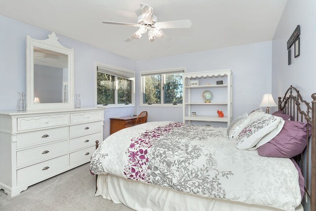 bedroom featuring ceiling fan and light colored carpet