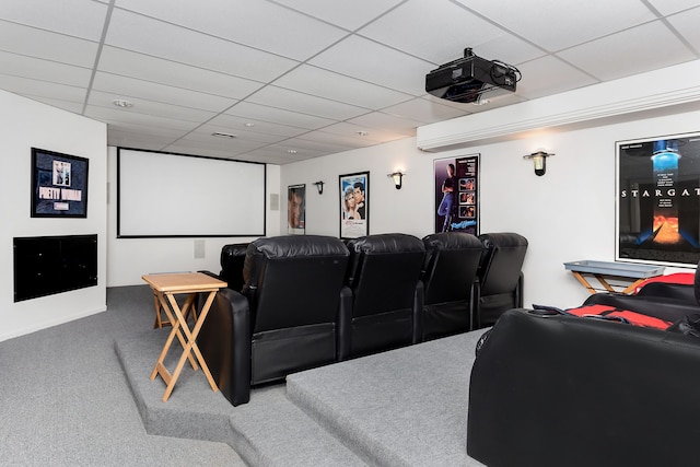 cinema with carpet floors and a paneled ceiling