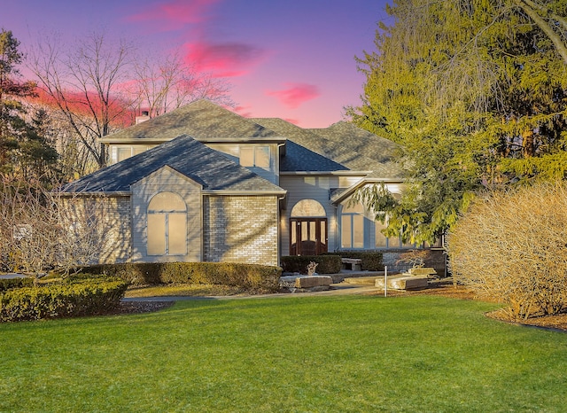 view of front of house with a yard