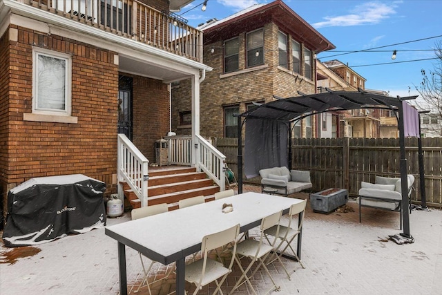 view of patio / terrace featuring a balcony, a pergola, and area for grilling