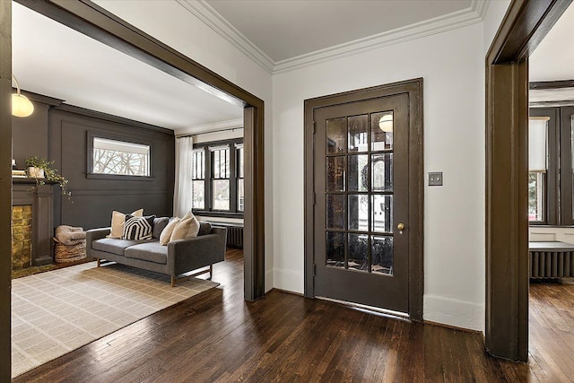 entryway featuring ornamental molding and dark wood-type flooring