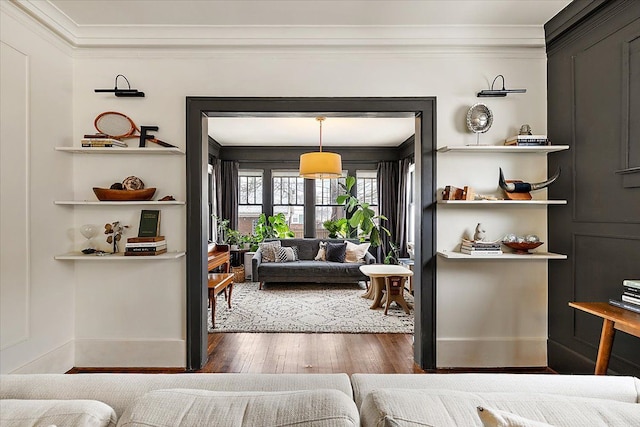 interior space with crown molding and dark hardwood / wood-style flooring