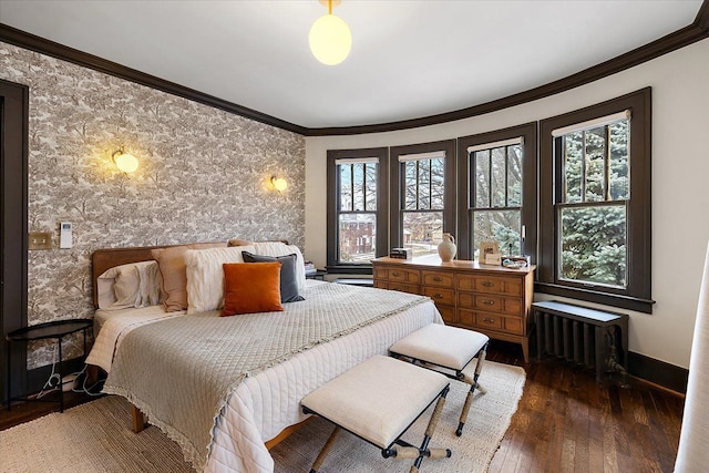 bedroom with dark hardwood / wood-style flooring, radiator heating unit, and crown molding